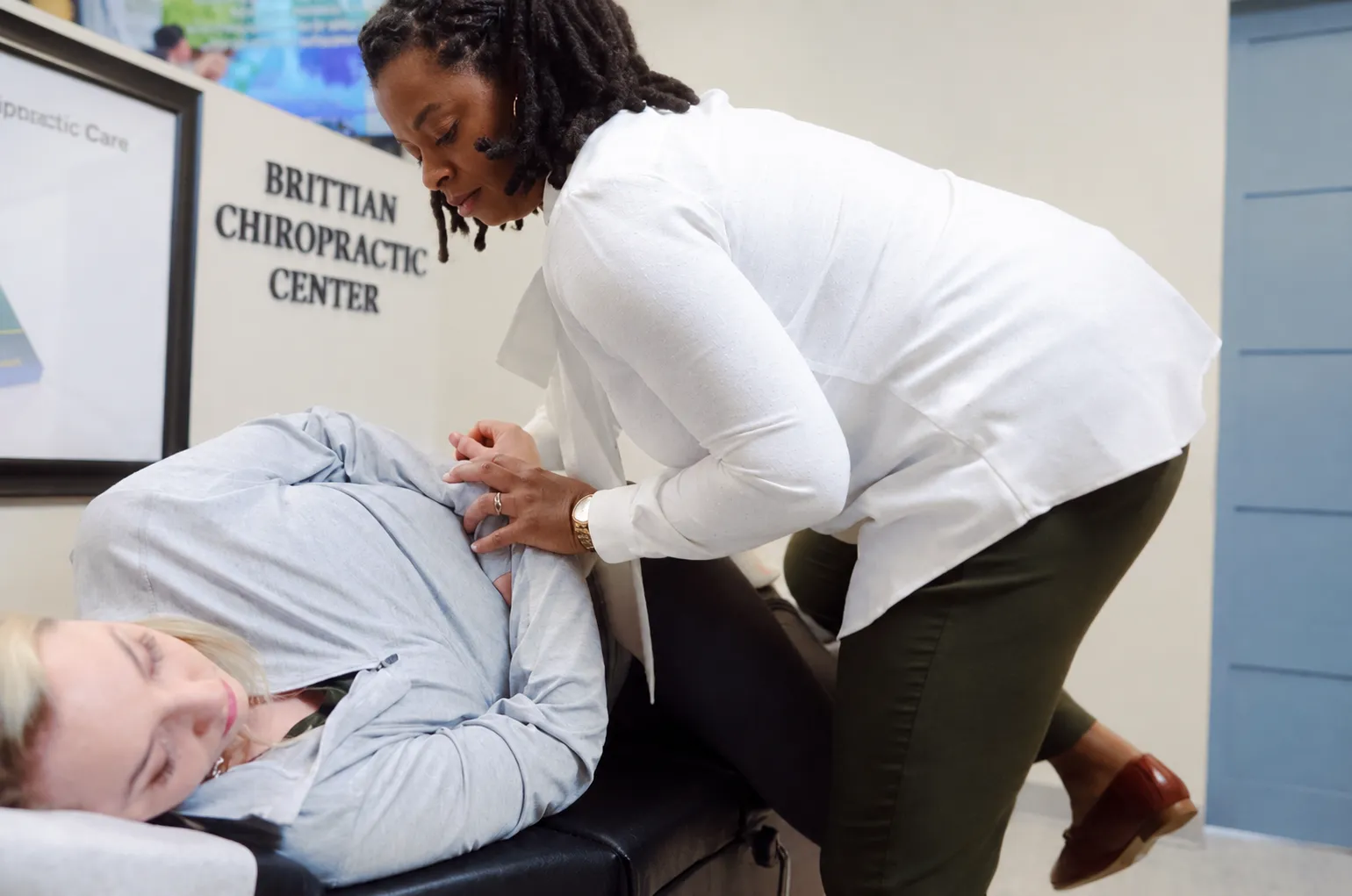 Chiropractor treating a patient