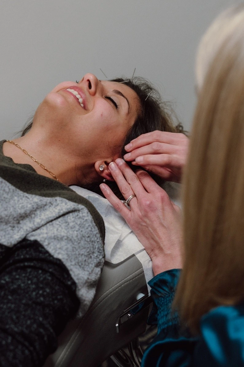 Chiropractor explaining spine care to a patient