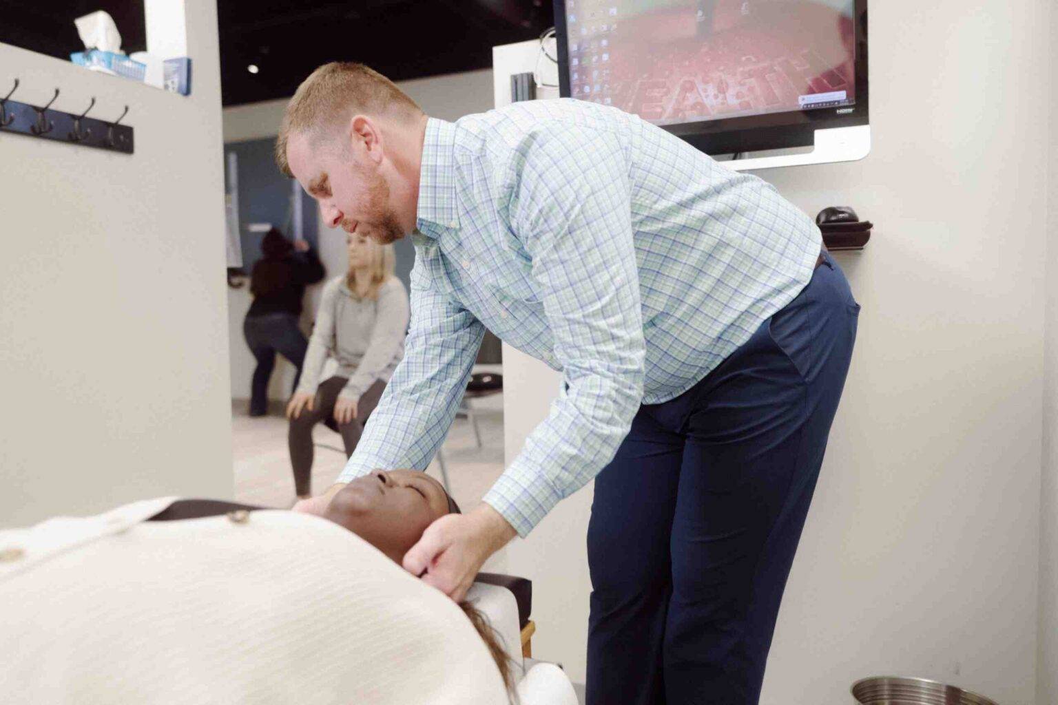 Chiropractor consulting with a patient