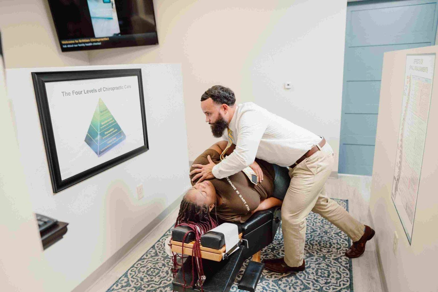 Chiropractor consulting with a patient