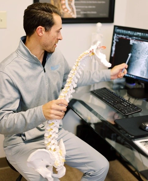 Chiropractor consulting with a patient