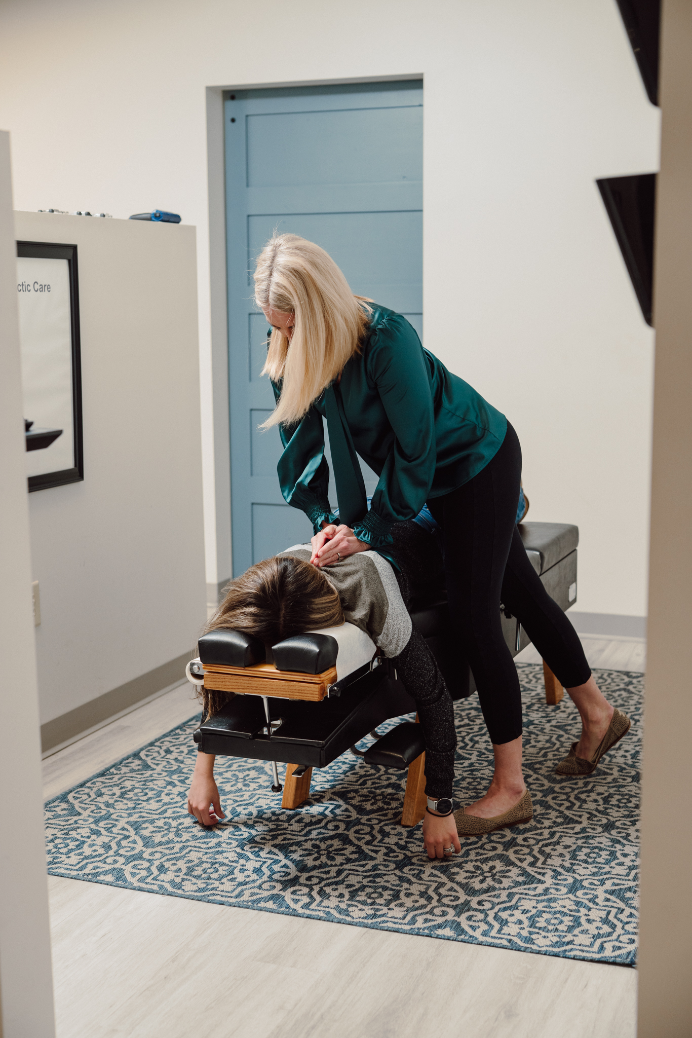 Chiropractor consulting with a patient